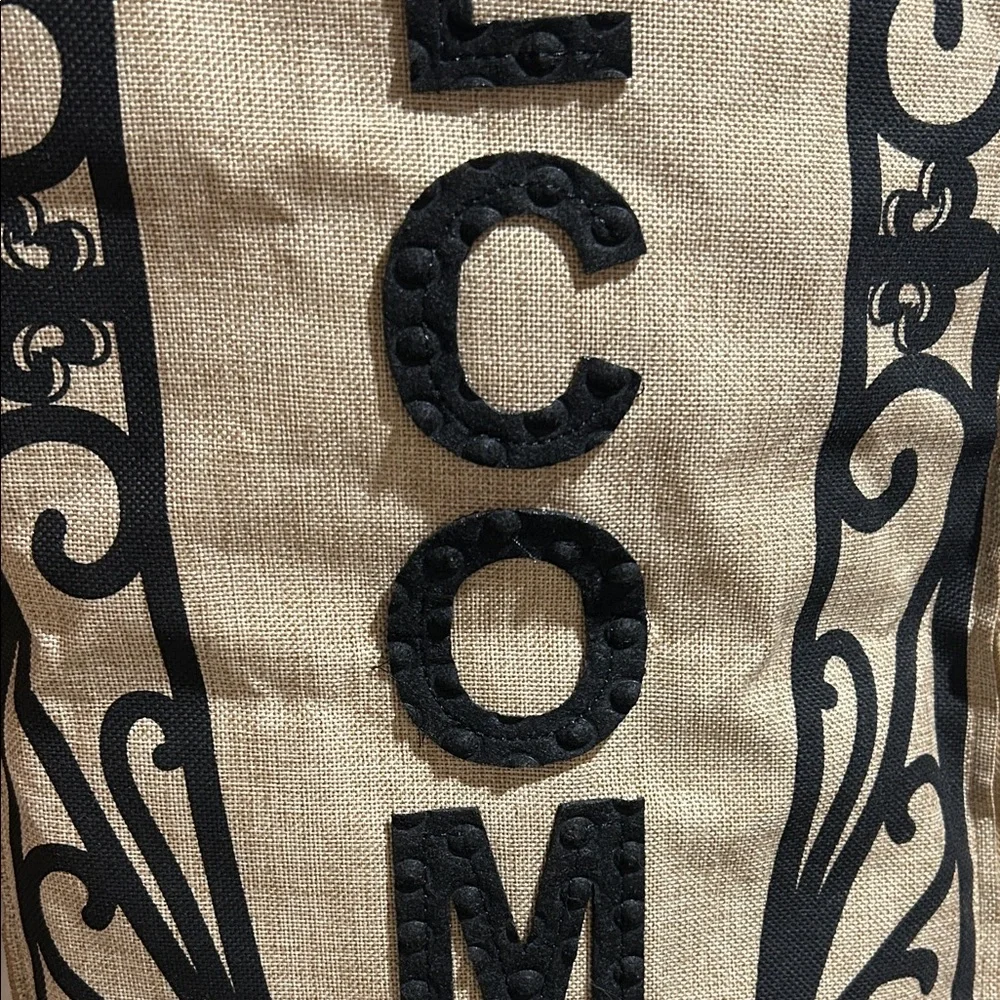 Black and Tan Welcome Sign